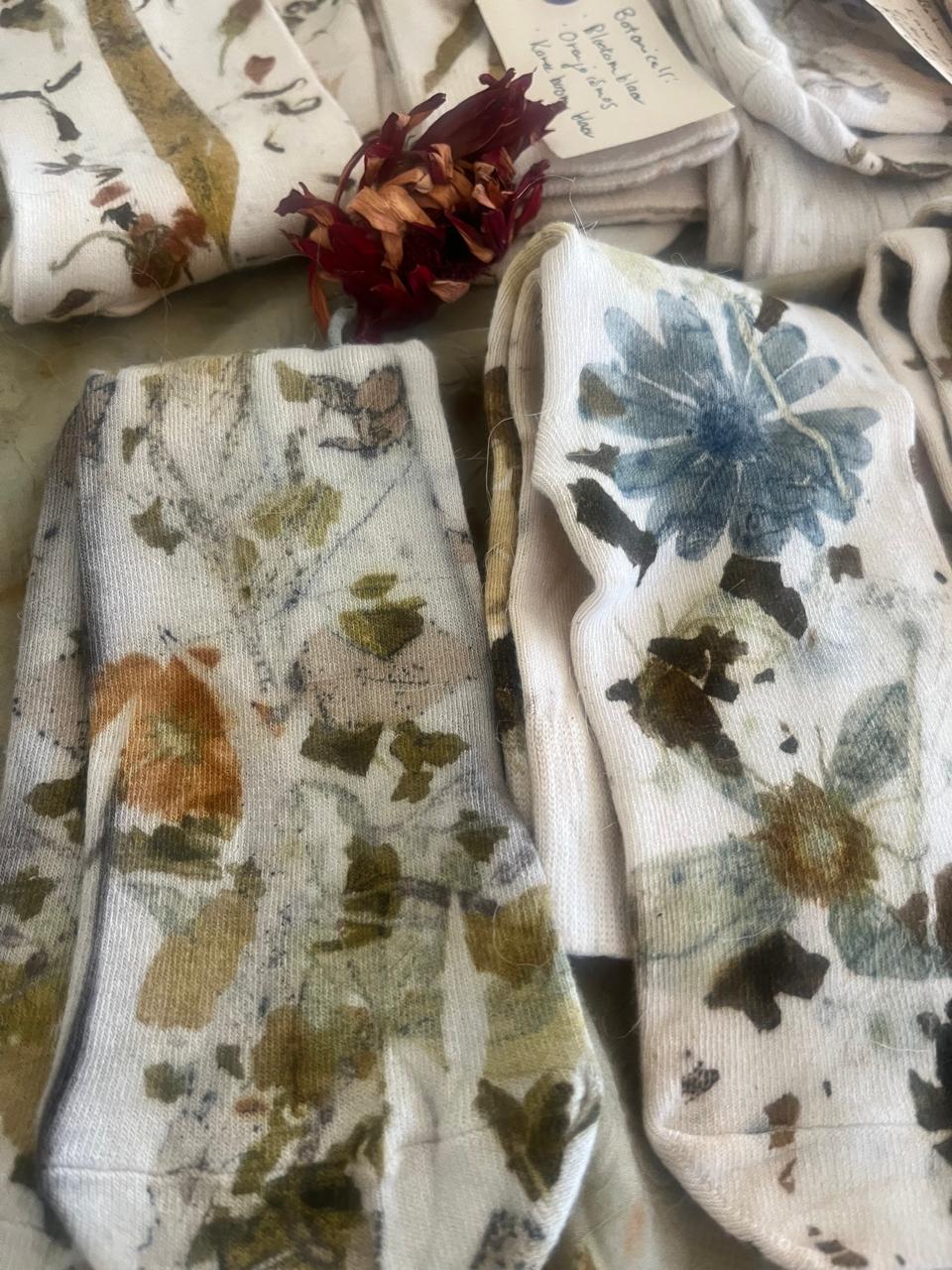 Eco-printed botanical socks with blue and olive flower prints