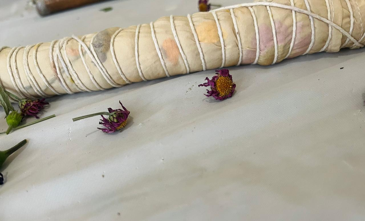 A botanical print bundle wrapped in twine, ready for a home eco printing kit